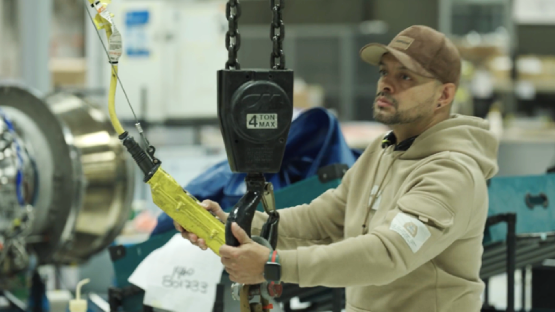 Man hitting button of a crane