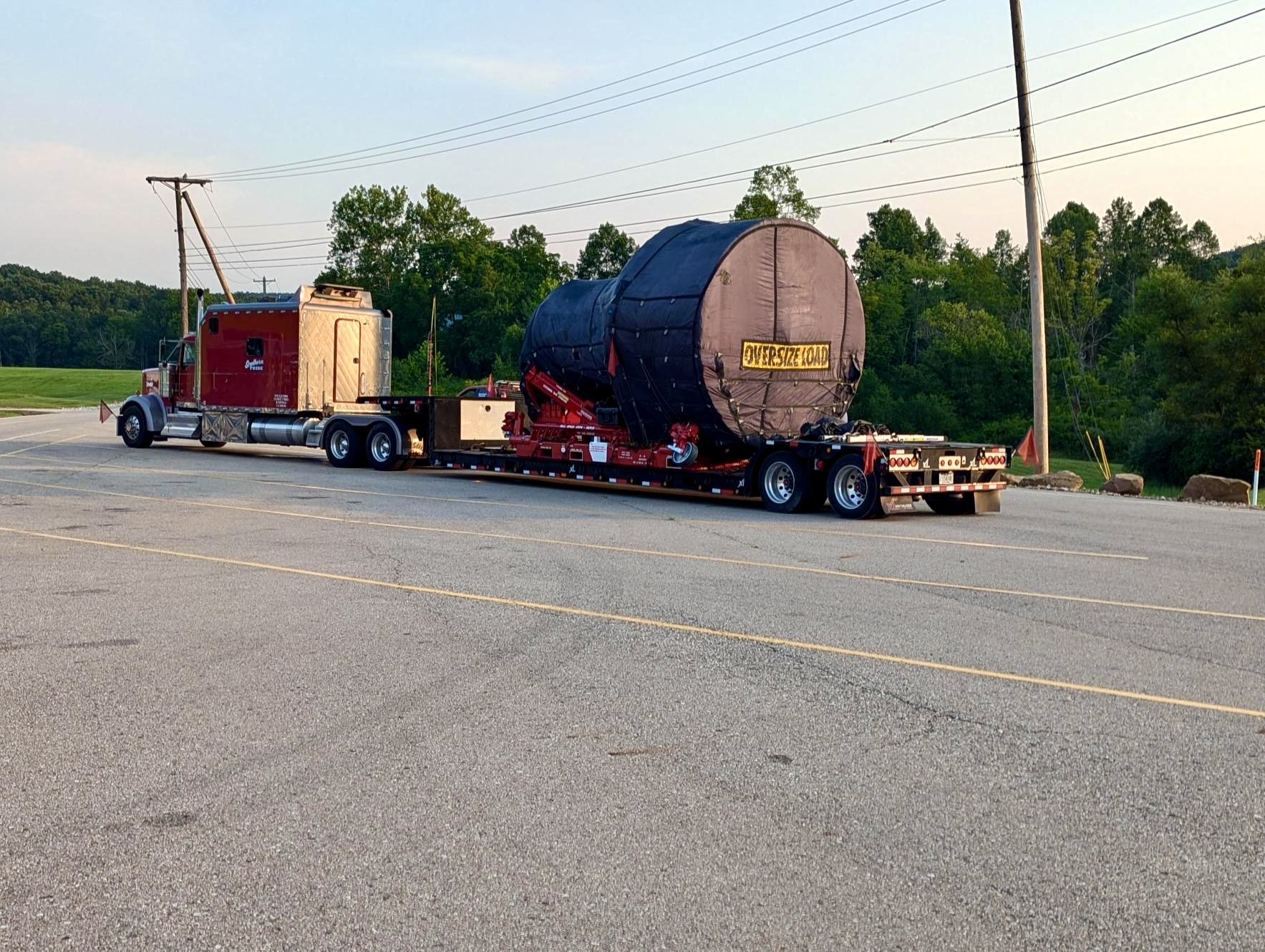 GE9X engine on a truck bed on the road