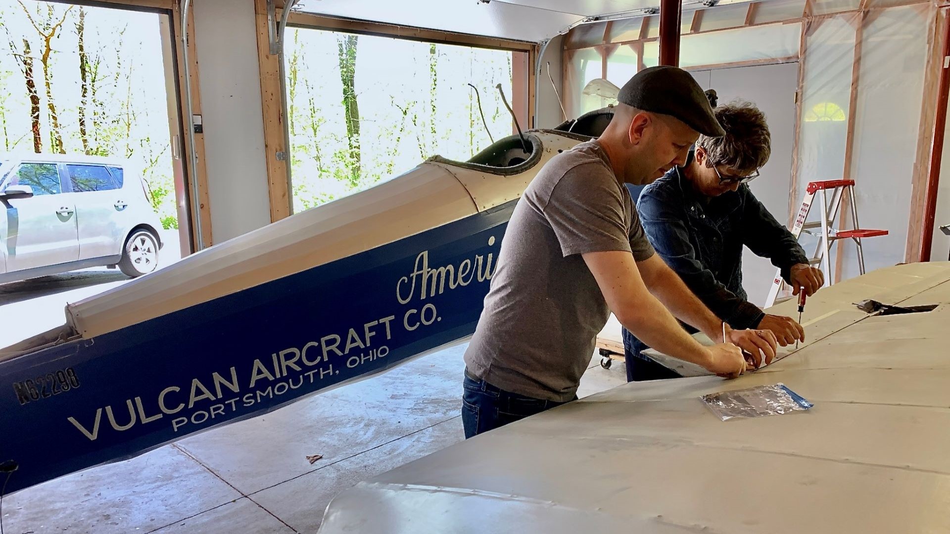 Nick Hurm and Kate Tiffany working on Moth monoplane