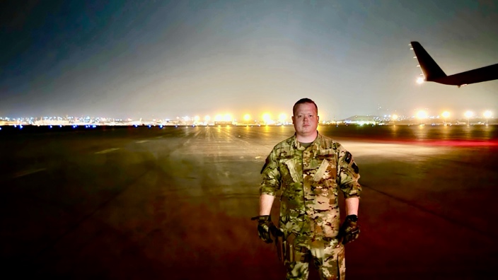 Zach Webb in uniform on a tarmac