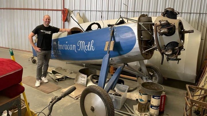 Nick Hurm standing with the Vulcan American Moth monoplane